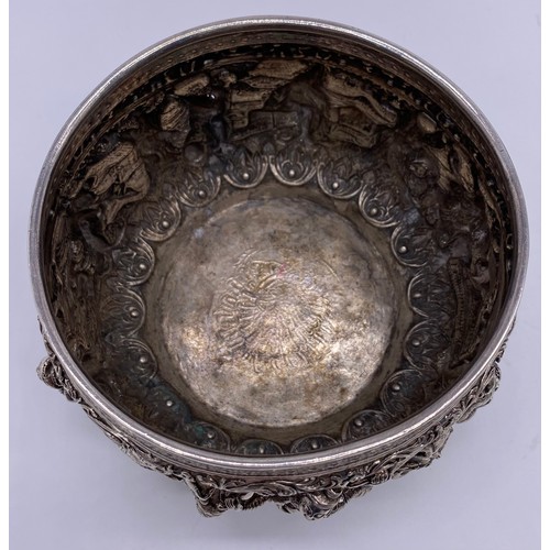 24 - A mid-19 th century Burmese silver bowl
Unmarked, all-over decoration of band of
figures
Diameter: 1... 