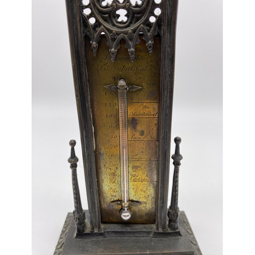 26 - Victorian Gothic revival cast brass table
thermometer, the brass engraved plate held
in tall Gothic ... 