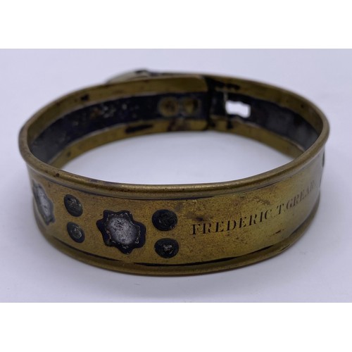 27 - A mid-19 th century brass and steel pet collar
Steel band in a pierced brass sleeve,
engraved Freder... 