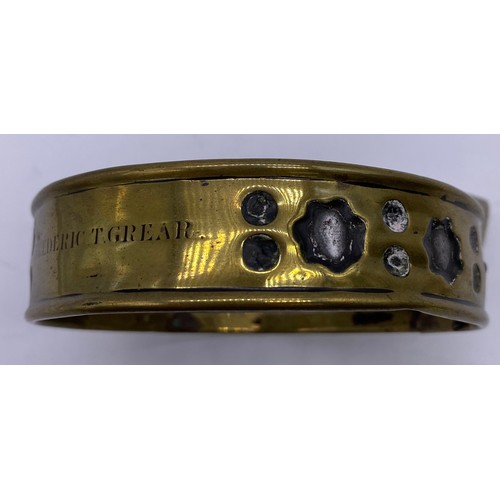 27 - A mid-19 th century brass and steel pet collar
Steel band in a pierced brass sleeve,
engraved Freder... 