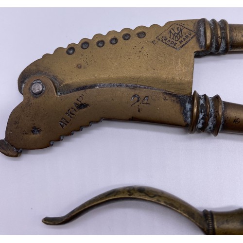 29 - 19th century brass betel cutter, trade marks
and retailer, ribbed detail; a pair of 17 th
century st... 