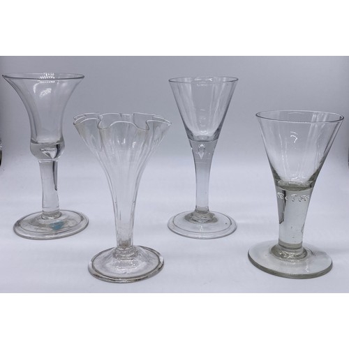 56 - Four pieces of antique glass; 19th century bell shaped wine glass, trumpet wine goblet with air tear... 