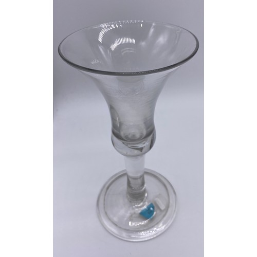 56 - Four pieces of antique glass; 19th century bell shaped wine glass, trumpet wine goblet with air tear... 