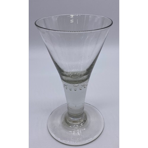 56 - Four pieces of antique glass; 19th century bell shaped wine glass, trumpet wine goblet with air tear... 