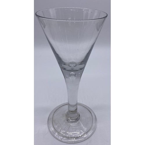 56 - Four pieces of antique glass; 19th century bell shaped wine glass, trumpet wine goblet with air tear... 