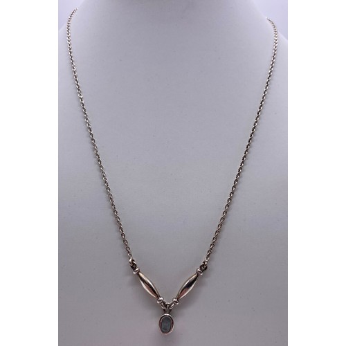 33 - Ladies silver chain and aquamarine stone pendant