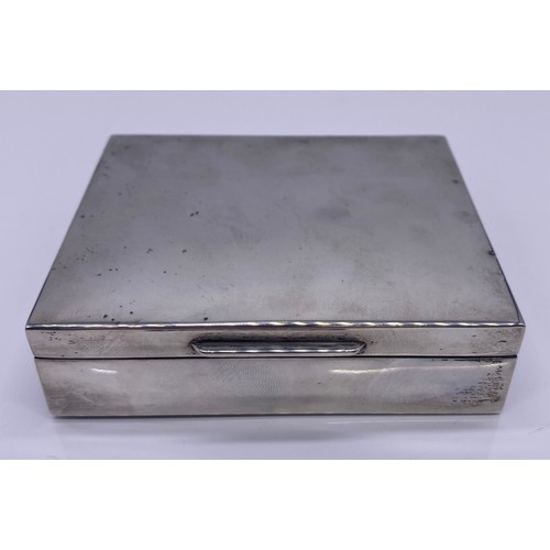 38 - Silver cigarette box fitted with a wooden interior
S J Rose & Son, London 
263g