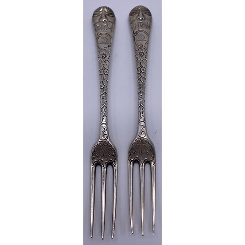 68 - Pair of three prong forks Circa 1750, boldly later decorated with chased foliage to the stems and ‘G... 