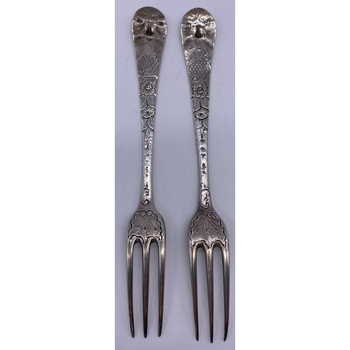 68 - Pair of three prong forks Circa 1750, boldly later decorated with chased foliage to the stems and ‘G... 