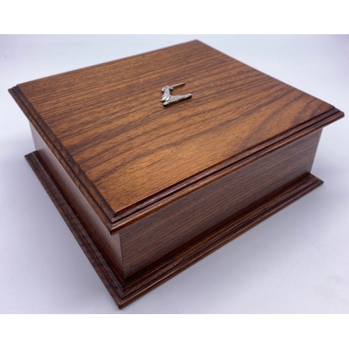 73 - An oak box, the rectangular lid with applied silver crest, the interior divided, platform base with ... 