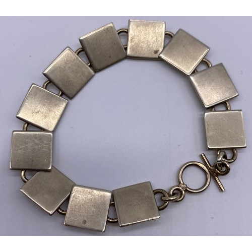 78 - Scottish contemporary silver bracelet PAL, Edinburgh, 2000, with millennium mark, modelled as flat s... 