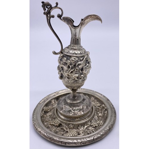 80 - An Italian white metal small ewer Unmarked, bold cast decoration of scroll handle, elongated spout, ... 