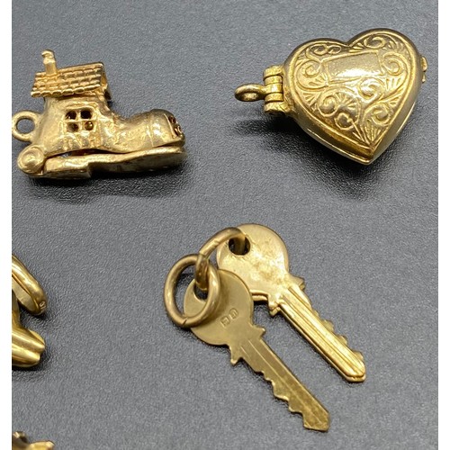 30A - Nine 9ct Gold Charms [12.2g]