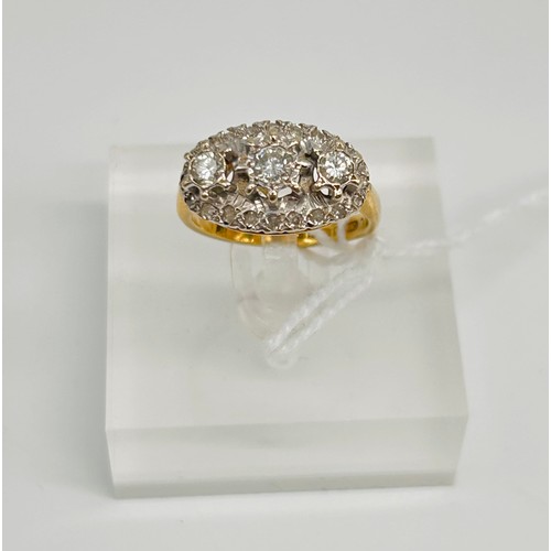 6 - 18ct yellow gold ladies ring, three centre larger diamonds surrounding by small diamonds comes with ... 