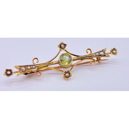 8 - Gold pin brooch onset small pearl, stamped M&M 9c Length: 55mm 
Together with an Edwardian peridot a... 