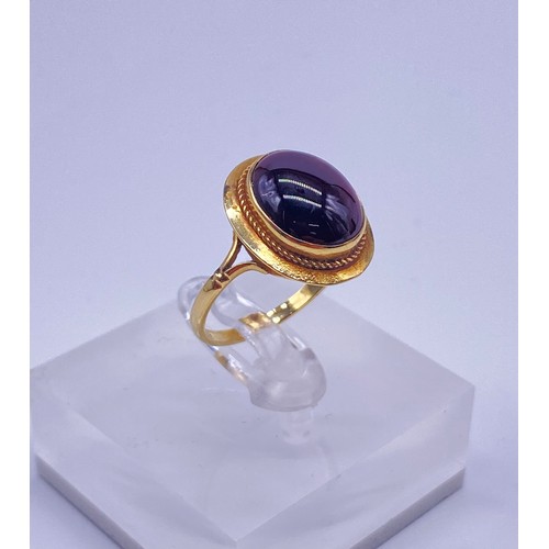 1 - 9ct gold ladies ring, oval cut cabochon garnet
Size:N
Weight:3.05g