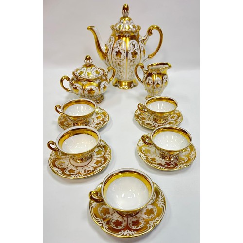 129 - Schlaggenwald Czechoslovakian tea set with teapot, sugar and cream in a gilt design