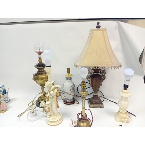 358 - Collection of six lamps to include onyx, urn style with shade, converted brass oil lamp, ceramic and... 