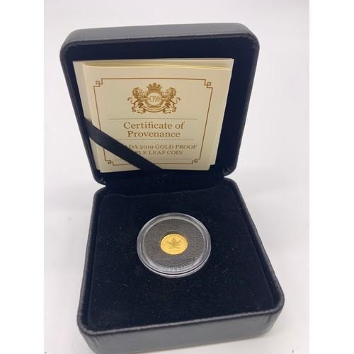 2 - 24ct Gold Canadian Maple Leaf Queen Elizabeth II coin 
Weight - 0.5g
Diameter 11mm