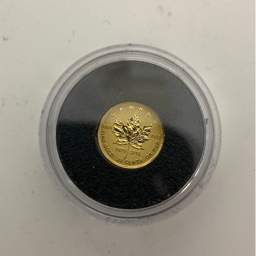 2 - 24ct Gold Canadian Maple Leaf Queen Elizabeth II coin 
Weight - 0.5g
Diameter 11mm