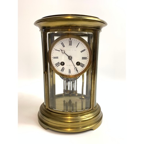 44 - French brass oval four glass mantel clock