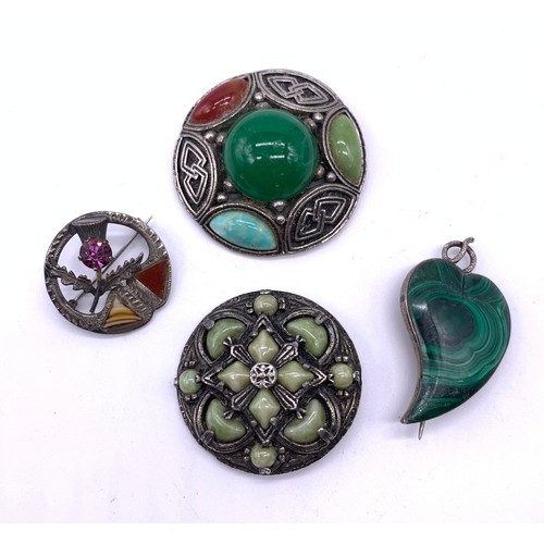 39 - Collection of four Scottish and Celtic brooches to include sterling silver