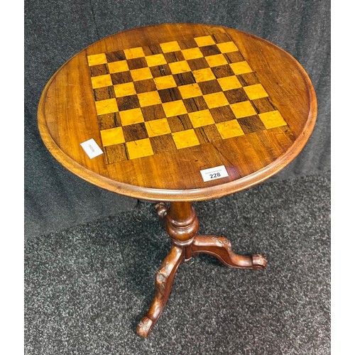 228 - An antique style side table the circular top with checkered chest board centre raised on a tripod ba... 