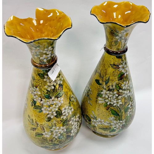 70 - Pair of Linthorpe pottery vases in a yellow tone with floral design [damaged]