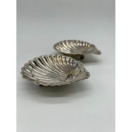 11 - Pair of silver scallop shell dishes Possibly William Davenport, Birmingham, 1903, of open shell form... 