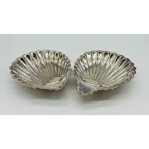 11 - Pair of silver scallop shell dishes Possibly William Davenport, Birmingham, 1903, of open shell form... 