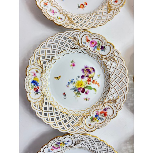 63 - Set of 9 Meissen porcelain dishes with openwork rims, the central roundel decorated with spaced flow... 