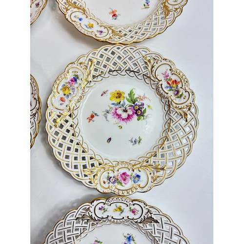 63 - Set of 9 Meissen porcelain dishes with openwork rims, the central roundel decorated with spaced flow... 