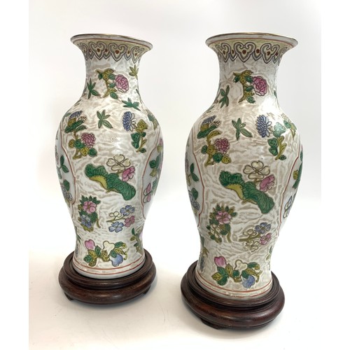 62 - Pair of Chinese 19th century Qing Dynasty floral vases with 6 character signature to base on wooden ... 