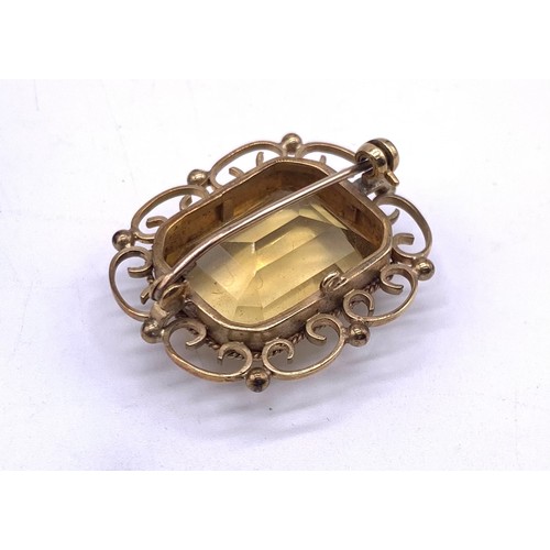 72 - 9ct yellow gold and citrine set brooch, gthe gold scrolling and ball frame with rectangular cut citr... 