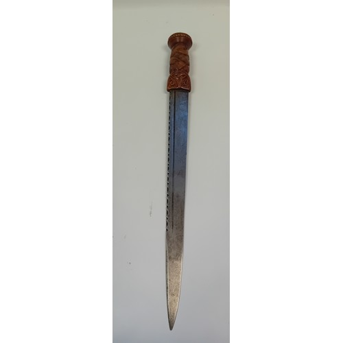 102 - An early 19th century Scottish dirk, knot carved grip, brass knop, blade late 18th century formed fr... 