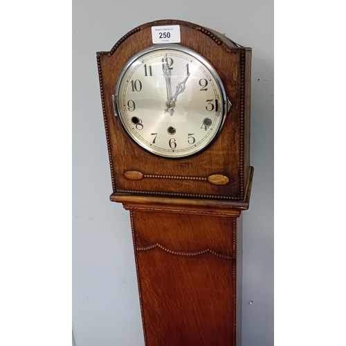 250 - 1930's Oak Granddaughter Clock marked to the inside ''All British Clocks''
[132cm]