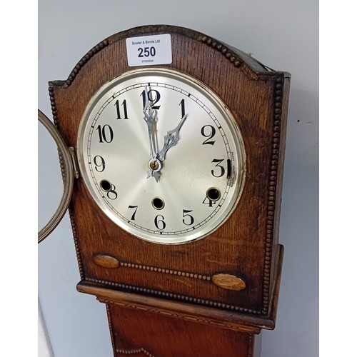 250 - 1930's Oak Granddaughter Clock marked to the inside ''All British Clocks''
[132cm]