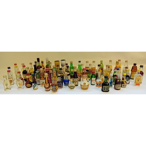 142 - Large collection of Branded Miniatures to include Whiskey, Gin, Wine, Tequila, Vodka etc