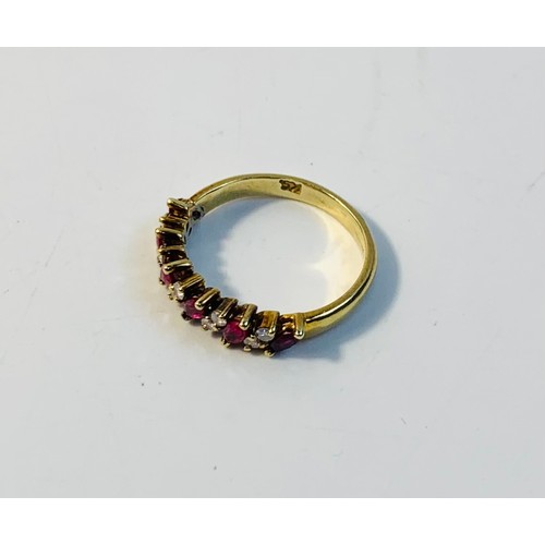 72 - Ruby and Diamond half eternity ring, set alternating navette claw set rubies and pairs of single cut... 