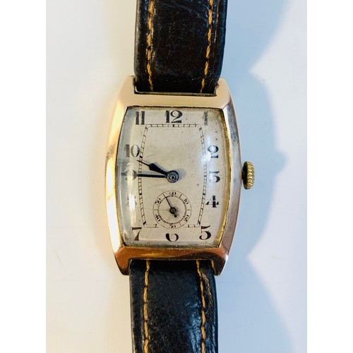 73 - 1930s 9ct gold cased wrist watch, tonneau shaped case, Arabic numerals, subsidiary seconds dial, lea... 