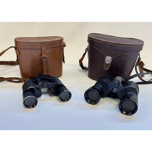 286 - Two pairs of binoculars in leather cases, one marked Harrods Knightsbridge & the other Swift