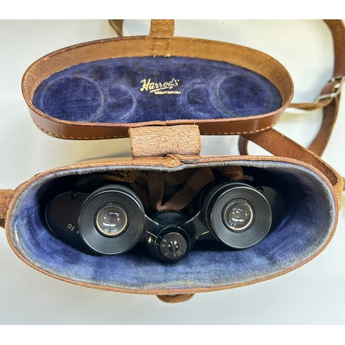 286 - Two pairs of binoculars in leather cases, one marked Harrods Knightsbridge & the other Swift