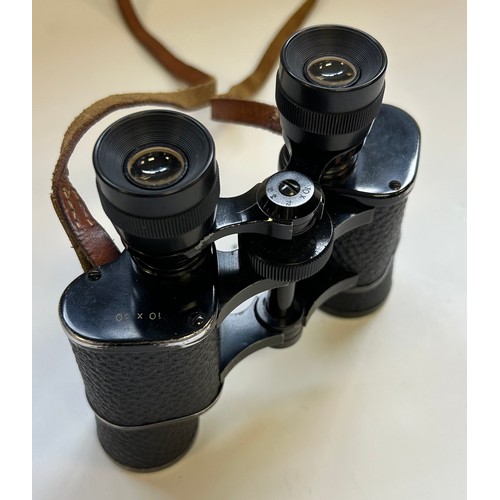 286 - Two pairs of binoculars in leather cases, one marked Harrods Knightsbridge & the other Swift