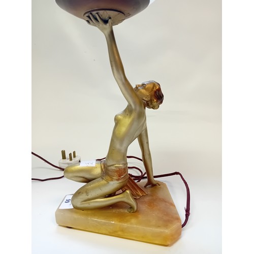 99 - Art Deco Figural Table Lamp on onyx base with glass shade
[Approx 47cm with shade]