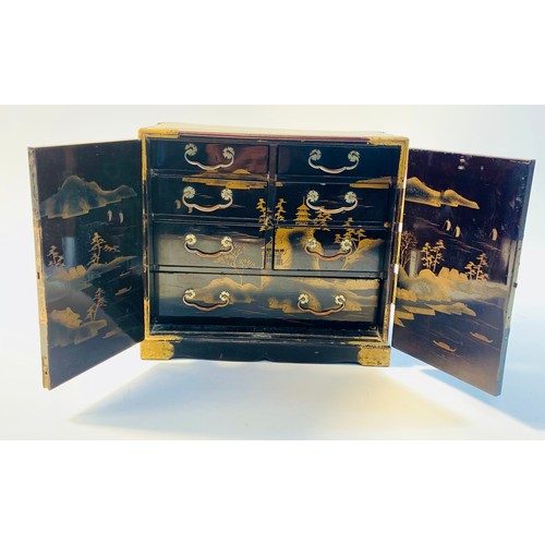 100A - Japanese Lacquer Kodansu table top cabinet, hand painted bird scene panel doors opening to seven dra... 