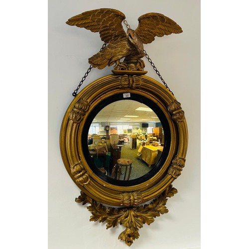 233 - Regency giltwood mirror, the circular convex mirror within a reeded join, surmounted by an eagle, th... 