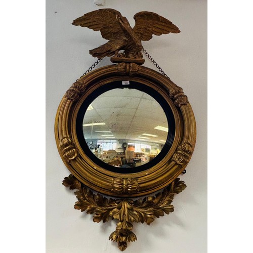 233 - Regency giltwood mirror, the circular convex mirror within a reeded join, surmounted by an eagle, th... 