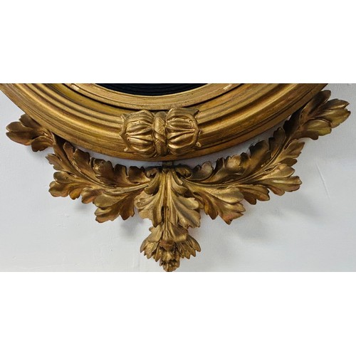 233 - Regency giltwood mirror, the circular convex mirror within a reeded join, surmounted by an eagle, th... 