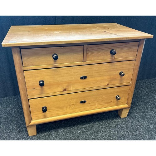 217 - A farmhouse pine chest, two short drawers above two long drawers raised on squared tapered legs  [76... 