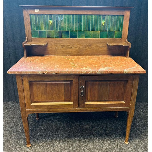 216 - A 19th Century wash stand, the splash back with green tiled centre above a marble surface and two cu... 